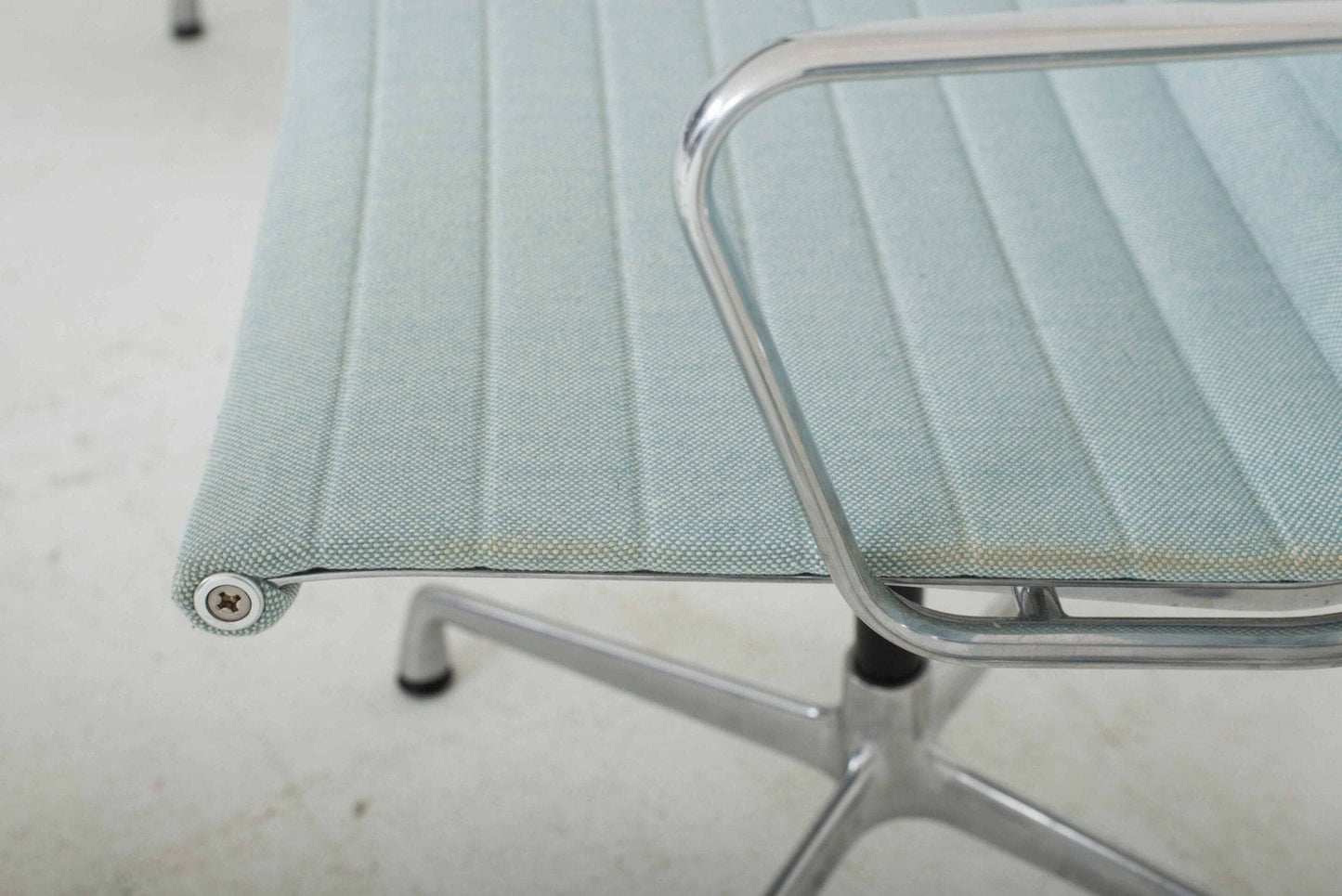 Vitra EA 104 Dinechair by Charles and Ray Eames in light blue hopsack and polished aluminum Vintage